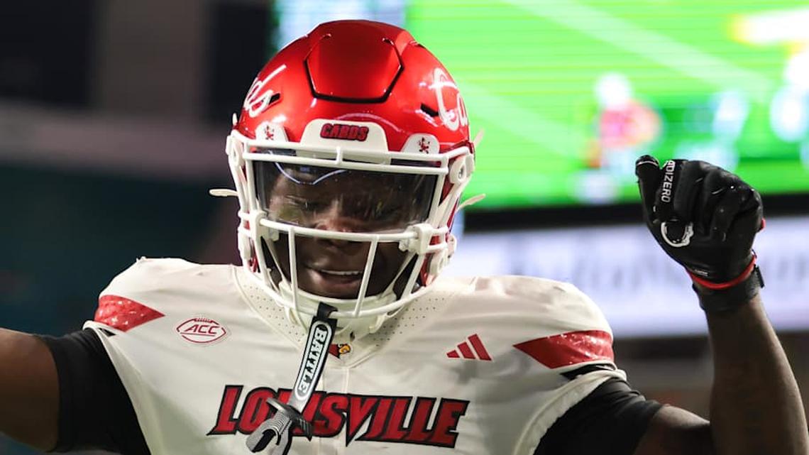  Oct 17, 2025; Miami Gardens, Florida, USA; Louisville Cardinals wide receiver Chris Bell (0) celebrates after scoring a touchdown against the Miami Hurricanes during the first quarter at Hard Rock Stadium. Mandatory Credit: Sam Navarro-Imagn Images | Sam Navarro-Imagn Images 