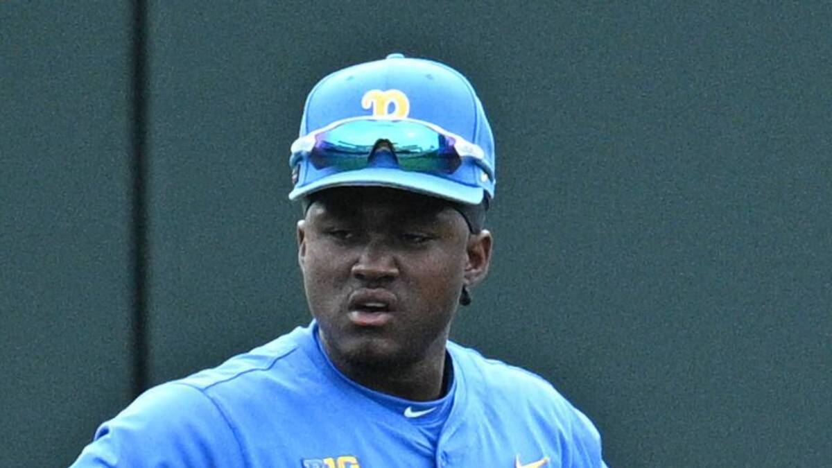  Jun 17, 2025; Omaha, Neb, USA; UCLA Bruins left fielder Dean West (36) and center fielder Payton Brennan (11) and right fielder A.J. Salgado (24) wait out a pitching change against the LSU Tigers during the fourth inning at Charles Schwab Field. Mandatory Credit: Steven Branscombe-Imagn Images | IMAGN IMAGES via Reuters Connect 