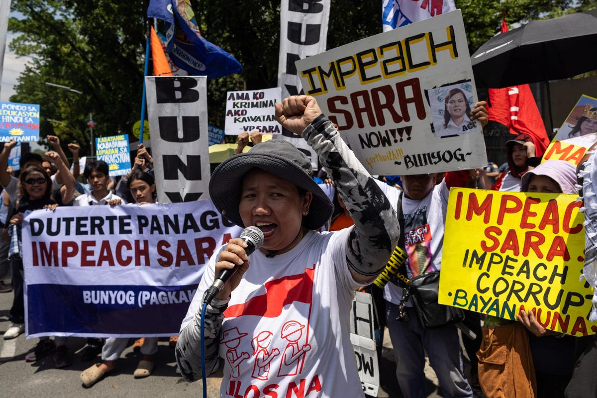 Protesters call for the impeachment of Philippine Vice President Sara Duterte ahead of a vote in the House of Representatives on whether to transmit the impeachment complaint to the Senate, outside the House of Representatives in Quezon City, Philippines, May 11, 2026. REUTERS/Eloisa Lopez