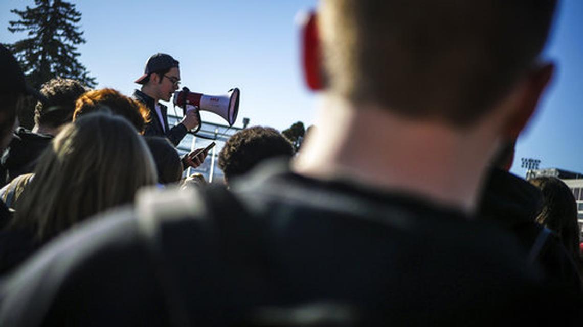 Students take part in a national school walkout in support of tougher gun-control laws Wednesday, March 14, 2018. In North Carolina, some conservative teens say, despite a Republican president and Congress, it's getting harder for them to express their political views in the wake of the Parkland, Florida, school shooting.