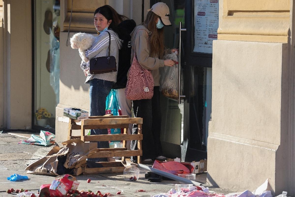People look on at the scene after several people were injured when a car drove into pedestrians in the center of the northern Italian city of Modena, Italy, May 16, 2026. REUTERS/Stringer