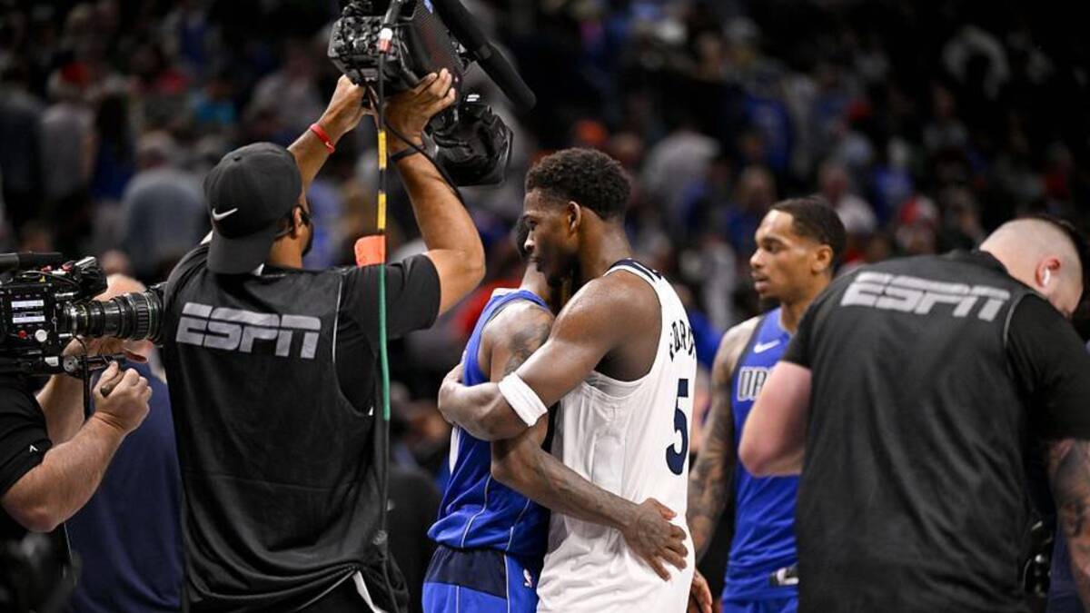  Dec 25, 2024; Dallas, Texas, USA; Dallas Mavericks guard Kyrie Irving (11) hugs Minnesota Timberwolves guard Anthony Edwards (5) after the game at the American Airlines Center. | Jerome Miron-Imagn Images 