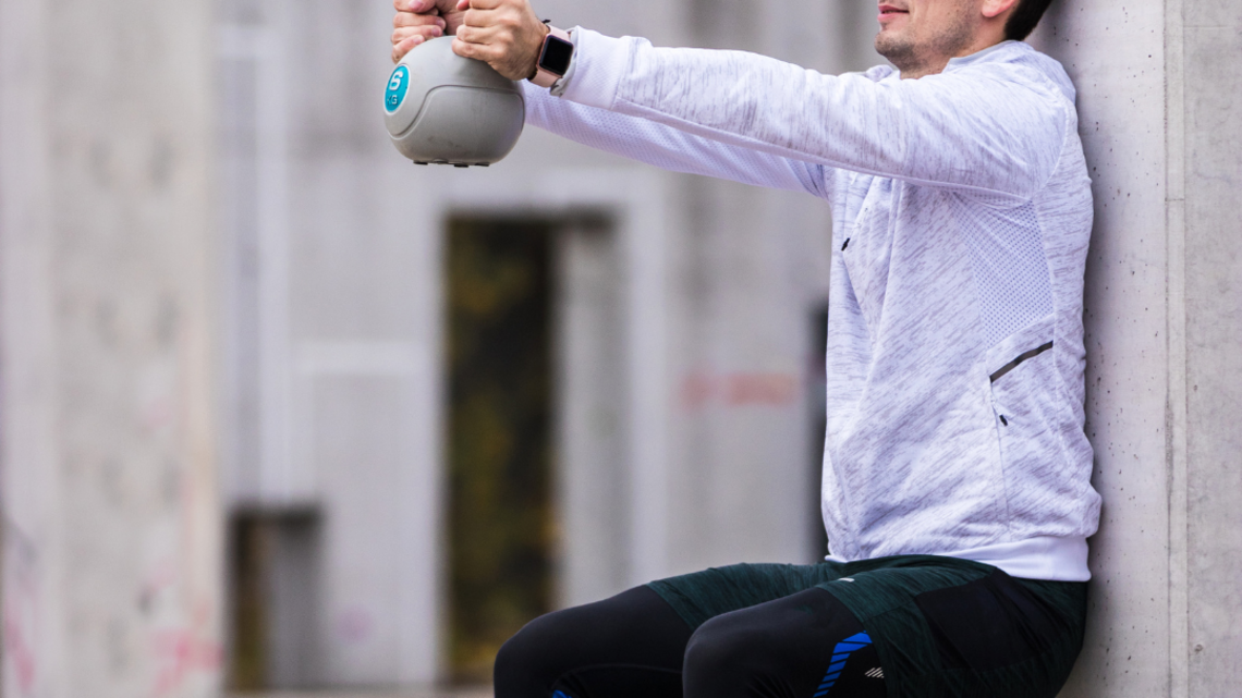 The Isometric Wall Sit Challenge That Will Set Your Quads on Fire