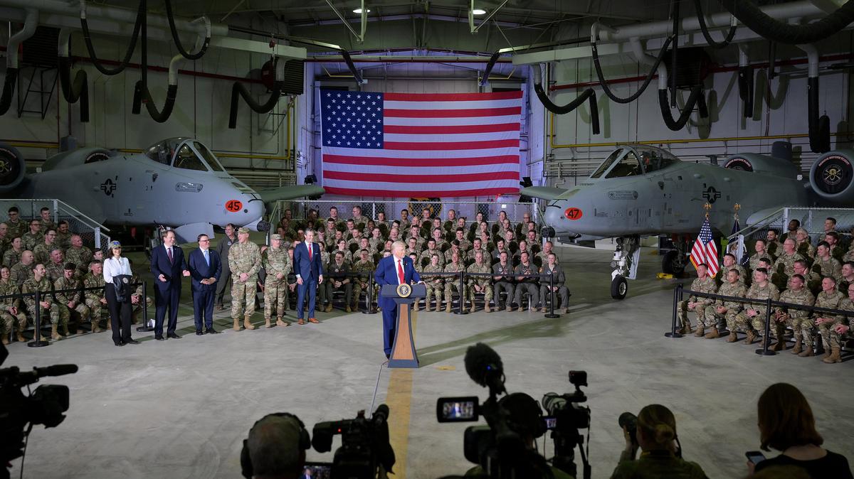 President Donald Trump speaks, flanked by 127th Wing personnel and A-10 Thunderbolts, aka Warthogs, at Selfridge Air National Guard Base in Harrison Township, Michigan, on April 29, 2025. (Robin Buckson/The Detroit News/TNS)