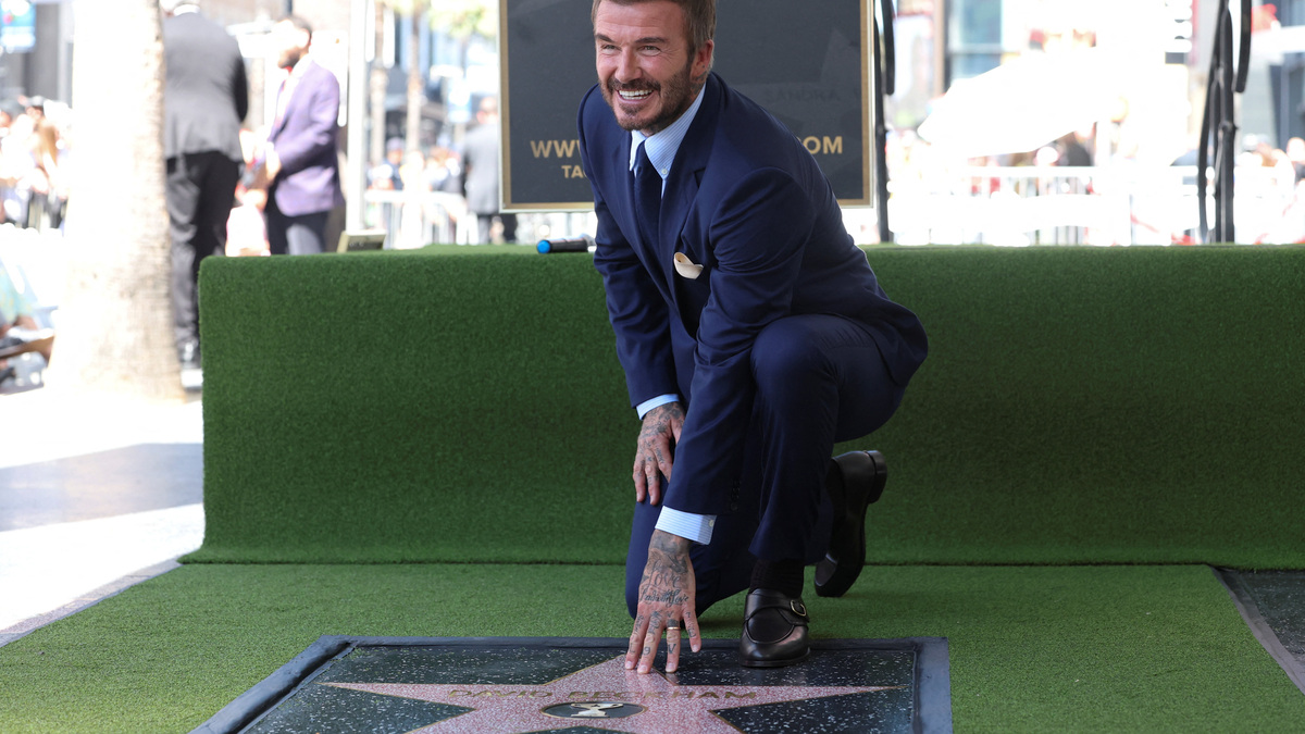 David Beckham poses on his star after it was unveiled on the Hollywood Walk of Fame in Los Angeles, California, U.S., June 12, 2026. REUTERS/Mario Anzuoni