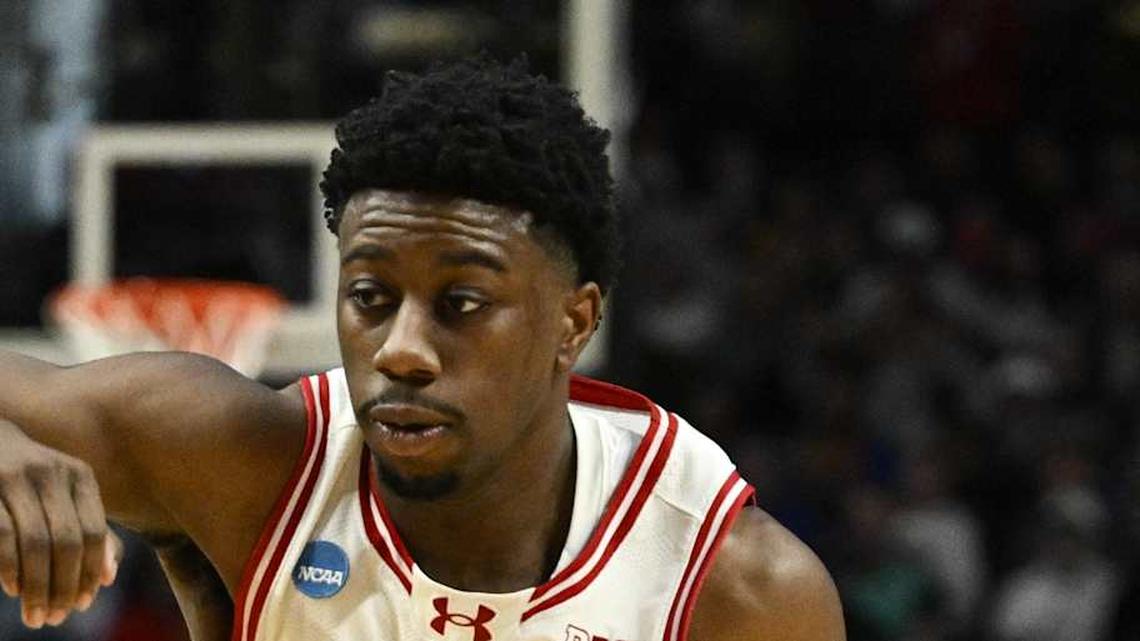  Mar 19, 2026; Portland, OR, USA; Wisconsin Badgers guard John Blackwell (25) drives against High Point Panthers guard Conrad Martinez (9) during the second half of a first round game of the men's 2026 NCAA Tournament at Moda Center. Mandatory Credit: Troy Wayrynen-Imagn Images | Troy Wayrynen-Imagn Images 