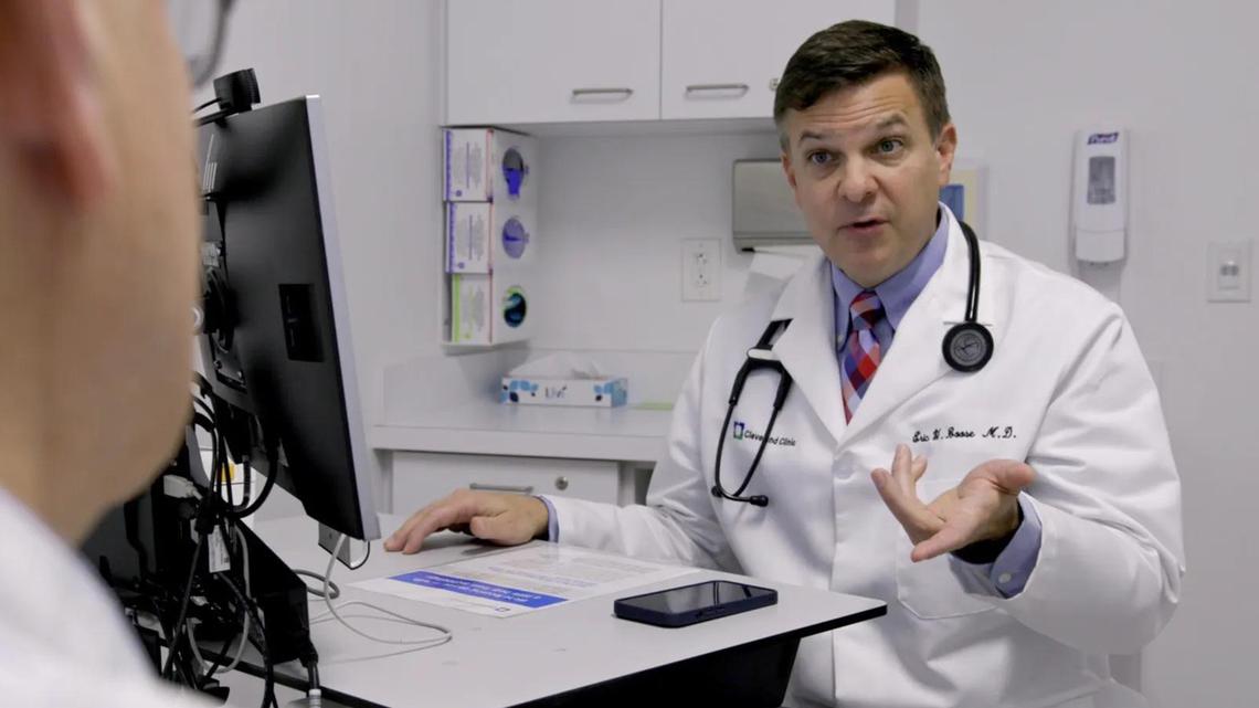 Eric Boose, a family medicine physician, uses AI software to document a patient’s appointment.