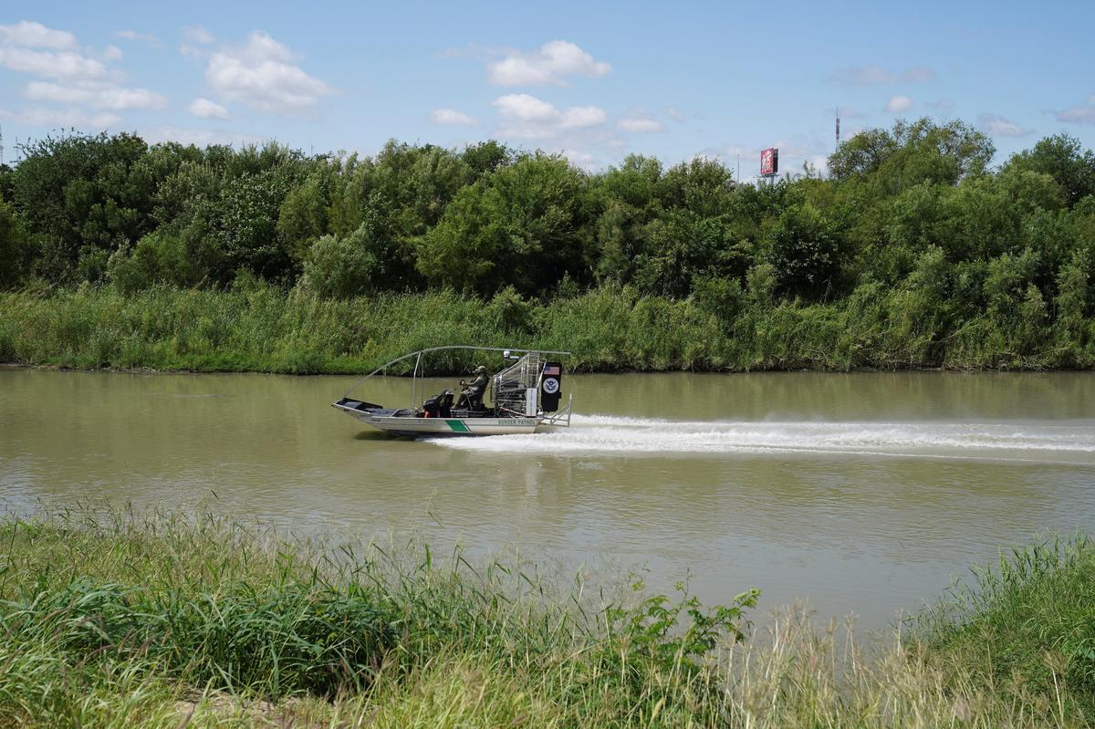Border Patrol agents oversee the Rio Grande after six bodies were found on Sunday in a train boxcar, in Laredo, Texas, U.S. May 11, 2026.  REUTERS/Gabriel V. Cardenas