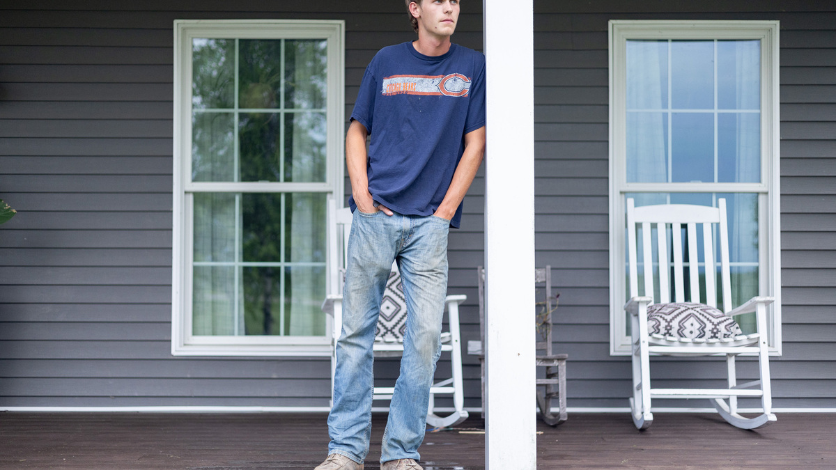 Jackson Leggett, 19, of Newark, Ill., stands on the porch of his home on June 11, 2026. (Josh Boland/Chicago Tribune/TNS)