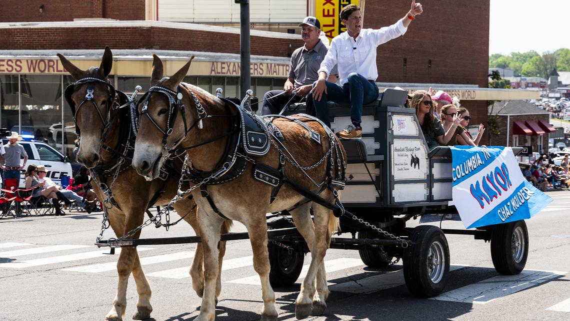 Chaz Molder, the mayor of Columbia, Tennessee, and a Democratic House candidate, rides on a wagon during the town's annual Mule Day parade on April 11. "We need to be a little nicer," said Molder, who hopes to show that Democrats can break through with rural voters.