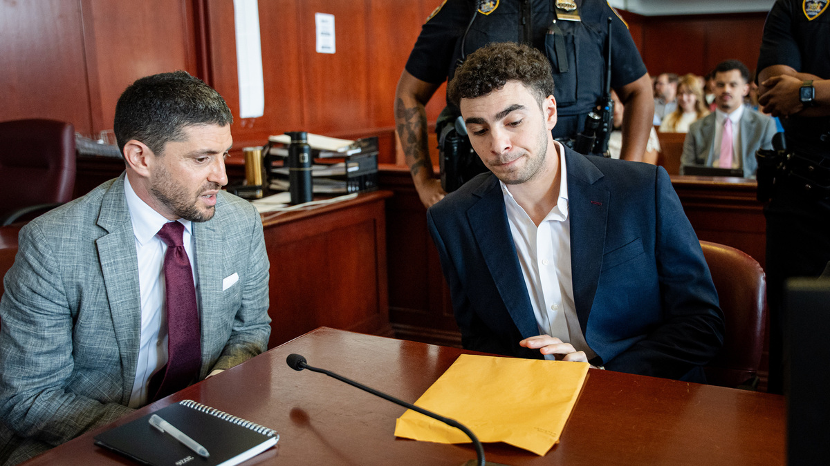 Luigi Mangione appears with lawyer Jacob Kaplan at a hearing at Manhattan Criminal Court on Wednesday in New York City. Mangione is charged with murder in the fatal shooting of UnitedHealthcare CEO Brian Thompson in Manhattan in December 2024.