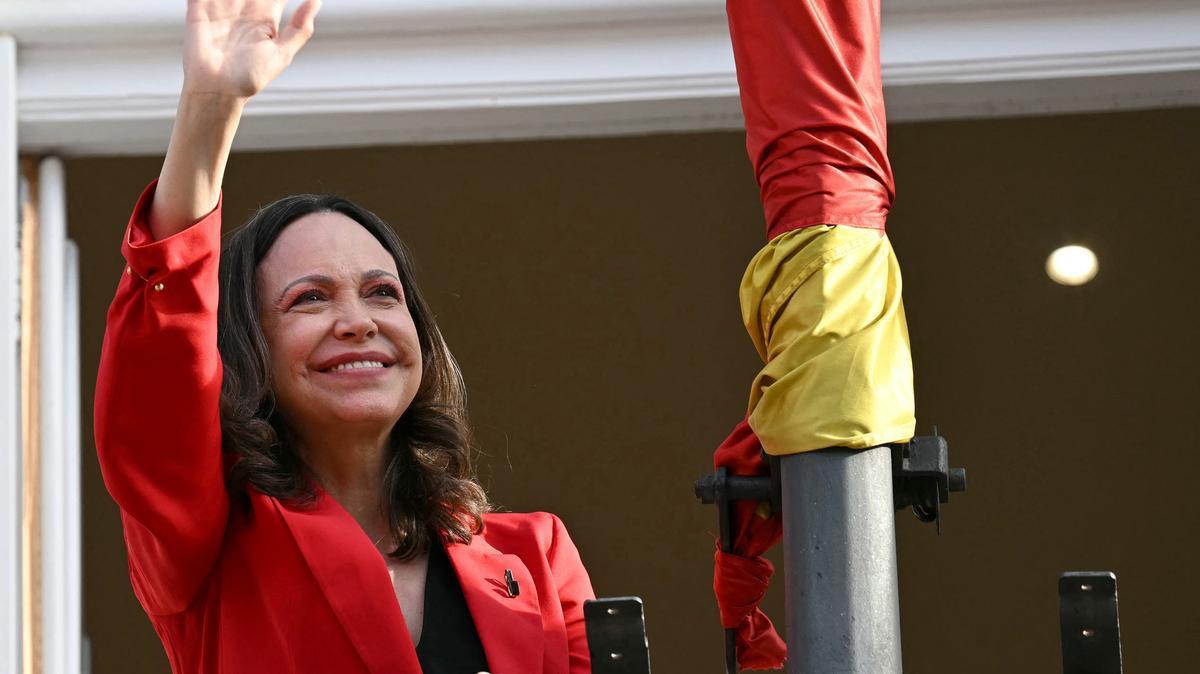Venezuelan opposition leader Maria Corina Machado waves to supporters in Madrid's Puerta del Sol on Saturday.