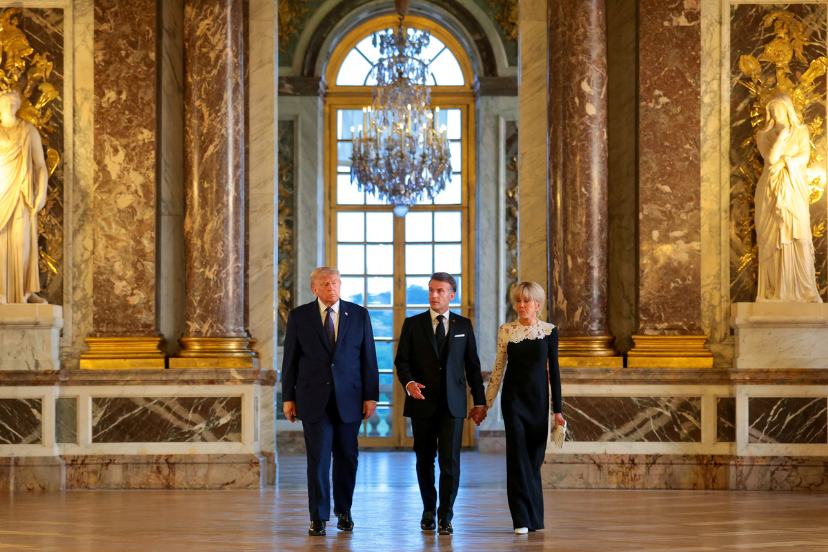 U.S. President Donald Trump receives a tour of Chateau de Versailles from President of France Emmanuel Macron ahead of a dinner, France, June 17, 2026. Anna Moneymaker/Pool via REUTERS