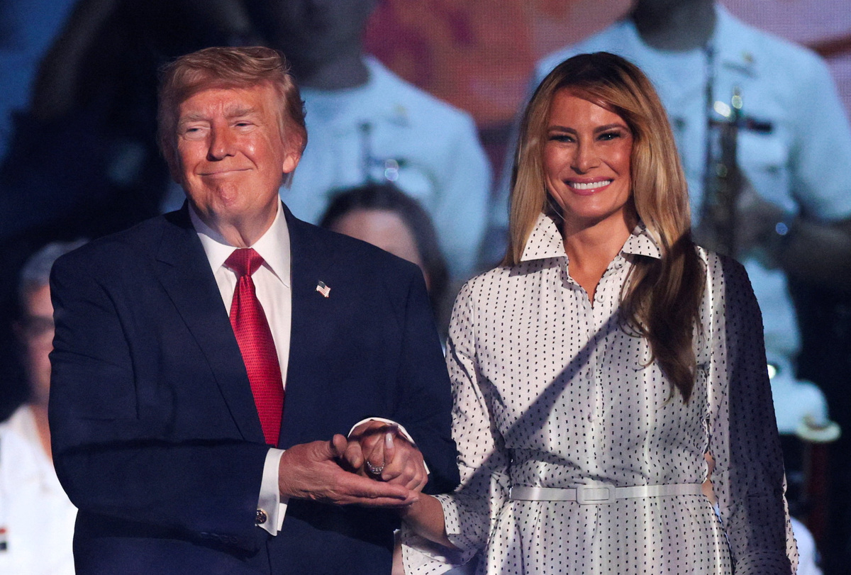 U.S. President Donald Trump and first lady Melania Trump hold hands as they attend a Fourth of July rally, marking the 250th anniversary of U.S. independence, on the National Mall in Washington, D.C., U.S., July 4, 2026. REUTERS/Evan Vucci