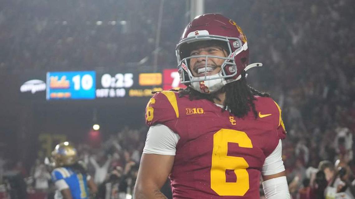  Nov 29, 2025; Los Angeles, California, USA; Southern California Trojans wide receiver Makai Lemon (6) celebrates after catching a 32-yard touchdown pass against the UCLA Bruins in the second half at United Airlines Field at Los Angeles Memorial Coliseum. Mandatory Credit: Kirby Lee-Imagn Images | Kirby Lee-Imagn Images 