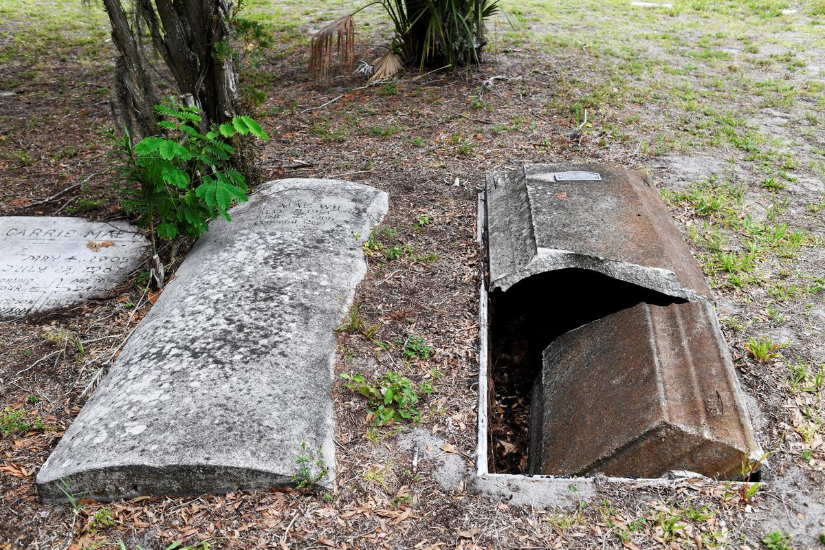 A grave at The Old Memphis Cemetery, a predominantly African-American cemetery, after the place was vandalized, with 17 gravesites and several headstones damaged in Palmetto, Florida, U.S., May 14, 2026. Authorities say “Trump” and “DeSantis” were spray-painted in red across several tombs as police continue investigating the incident. REUTERS/Octavio Jones