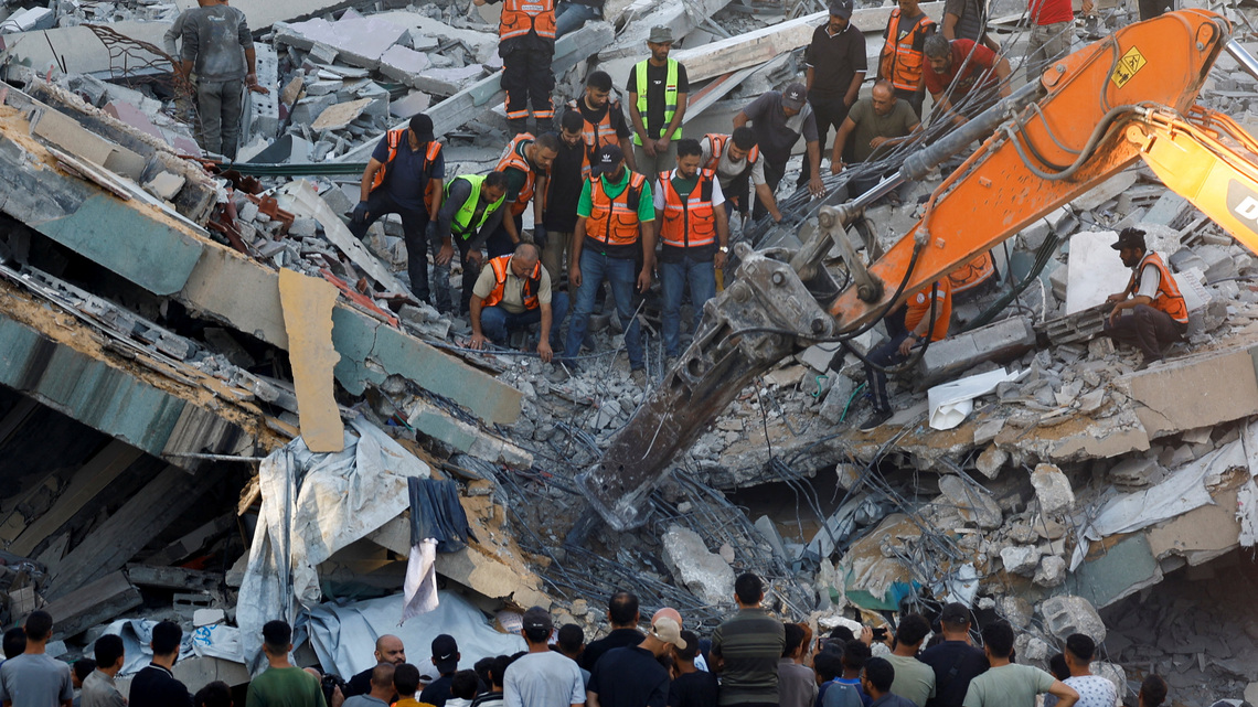 War-damaged Gaza building collapses, killing 20 people sheltering inside 