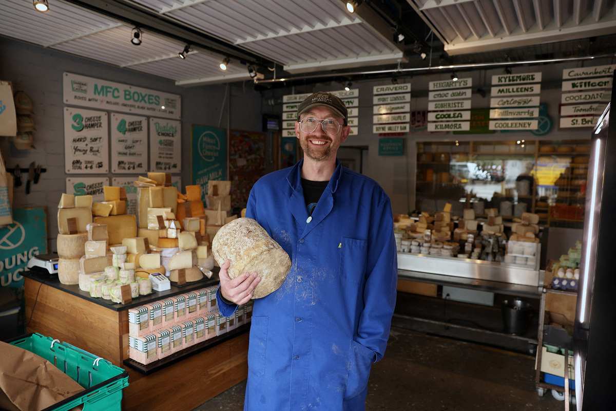 Mike Thomson, cheesemonger and owner of Mike's Fancy Cheese shop, poses for a photo in Belfast, Northern Ireland June 5, 2026. REUTERS/Cathal McNaughton