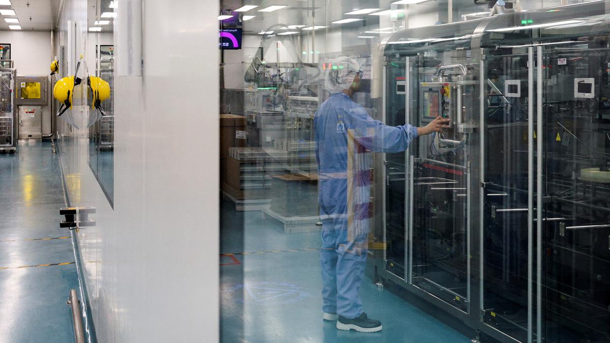 FILE PHOTO: An employee works on the production line for Caltrate, a calcium supplement, at a Haleon factory in Suzhou, Jiangsu province, China, March 10, 2026.  REUTERS/Go Nakamura/File Photo