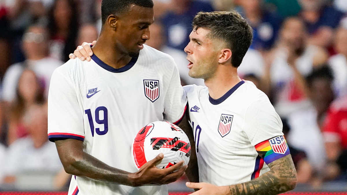 FILE - U.S. forward Christian Pulisic, right, hands the ball to Haji Wright (19) prior to a penalty kick during the second half of the team’ international friendly soccer match against Morocco on Wednesday, June 1, 2022, in Cincinnati. Tim Ream, Haji Wright, Joe Scally and Sean Johnson made the United States’ World Cup roster. (AP Photo/Jeff Dean, FIle)
