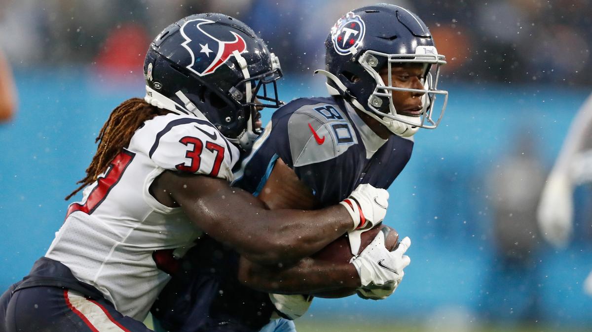 Houston Texans cornerback Tavierre Thomas (37) stops Tennessee Titans wide receiver Chester Rogers (80) in the second half of an NFL football game Sunday, Nov. 21, 2021, in Nashville, Tenn. (AP Photo/Wade Payne)