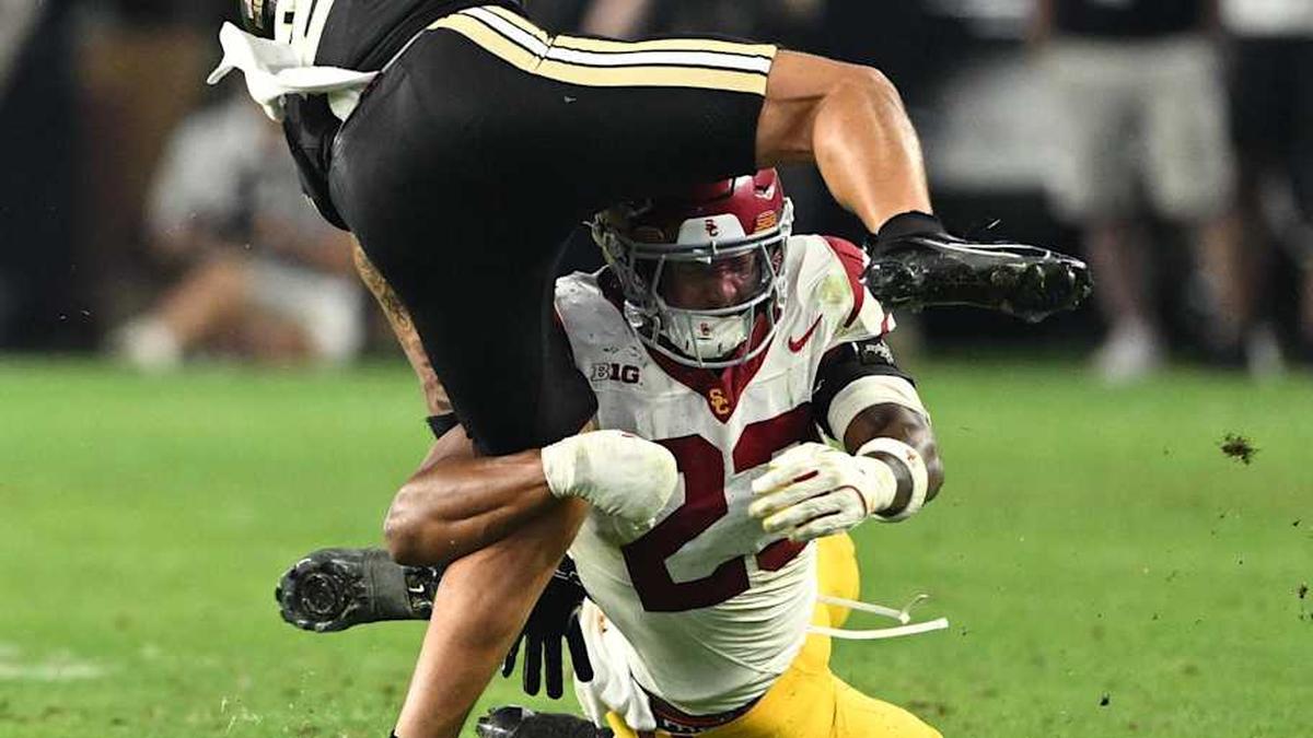  Sep 13, 2025; West Lafayette, Indiana, USA; Purdue Boilermakers wide receiver Michael Jackson III (2) is tackled by USC Trojans linebacker Desman Stephens II (23) during the second half at Ross-Ade Stadium. Mandatory Credit: Marc Lebryk-Imagn Images | Marc Lebryk-Imagn Images 