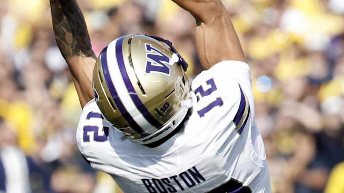  Oct 18, 2025; Ann Arbor, Michigan, USA; Washington Huskies wide receiver Denzel Boston (12) makes a reception in the first half against the Michigan Wolverines at Michigan Stadium. Mandatory Credit: Rick Osentoski-Imagn Images | Rick Osentoski-Imagn Images 