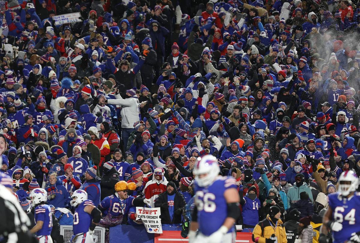  Buffalo Bills fans cheer and throw snow in the air after QB Josh Allen scores a touchdown during the AFC divisional game against the Kansas City Chiefs at Highmark Stadium in 2024. Imagn Images