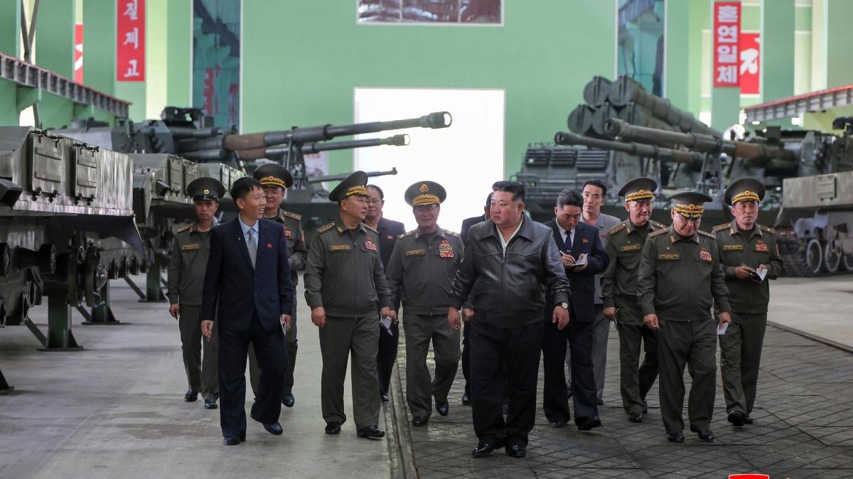 In this photo released Friday, North Korean leader Kim Jong Un (C) inspects a munitions factory where a new 155mm self-propelled gun-howitzer system is being produced. It will be deployed at the southern border this year, state media said. Photo by KCNA/EPA