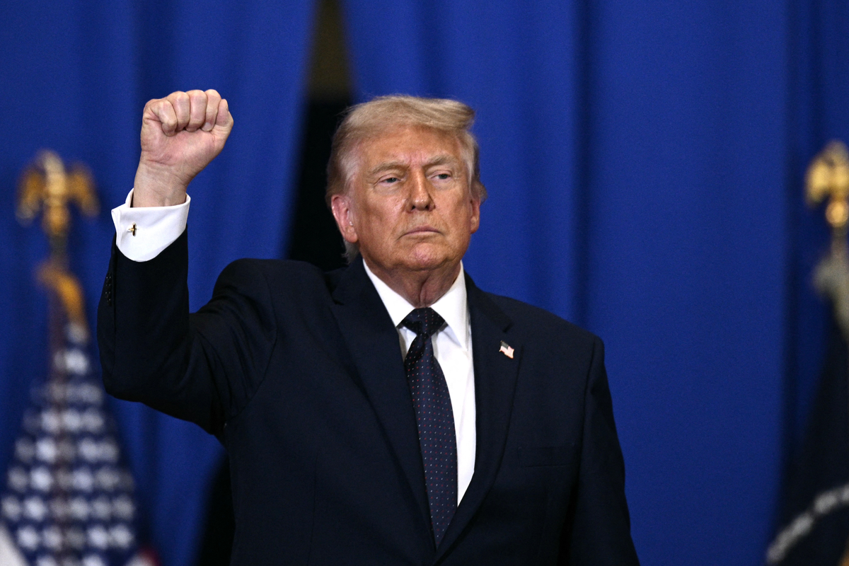  President Donald Trump raises a fist as he departs after delivering a speech in Suffern, New York, on May 22, 2026. 