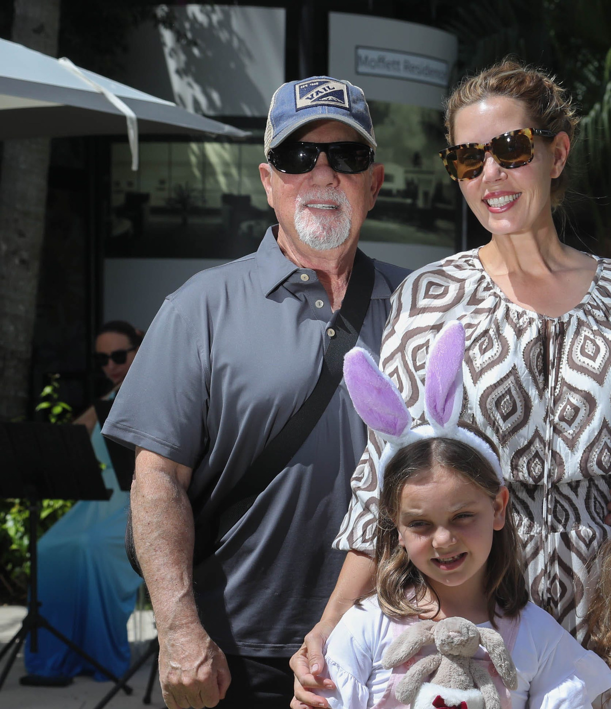 Musician and singer Billy Joel poses for a photo with his family at the Royal Poinciana Plaza during the Royal Easter Affair Saturday April 16, 2022.