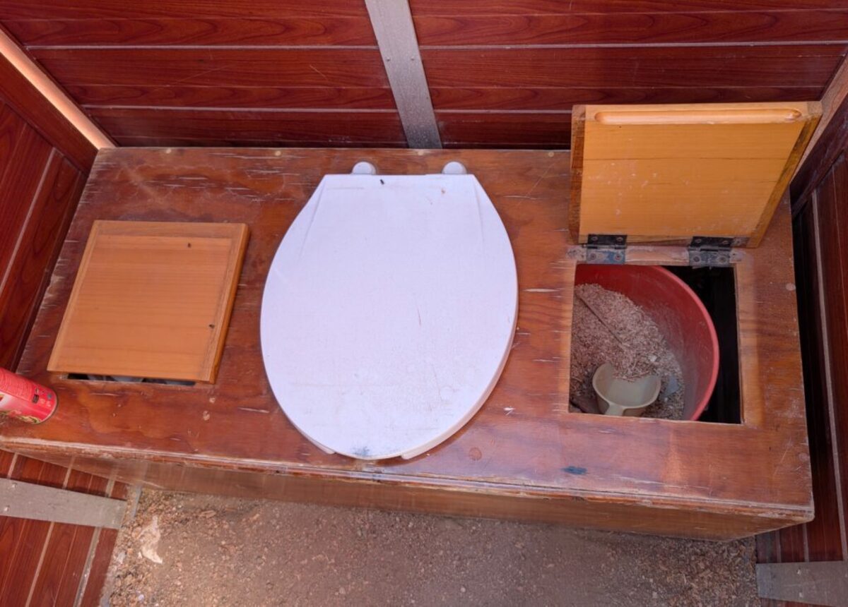  The toilet facilites are private but primitive. After you go, scroop up some saw dust ant sprinkle over the top of whatever you left behind. Photo credit: Cindy Richards 