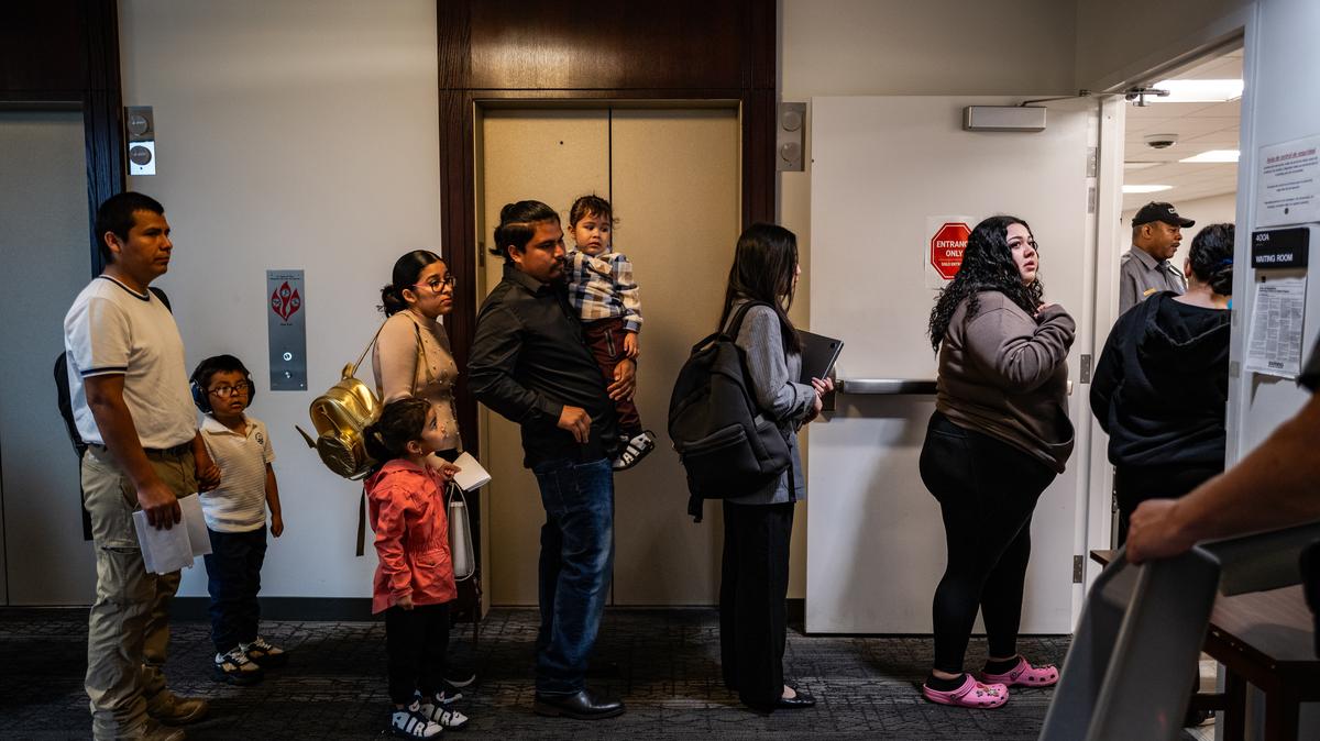 FILE -- Immigrants wait for their appointments at the Annandale Immigration Court in Annandale, Va., on May 26, 2026. A federal judge on Friday, June 5, 2026, invalidated policies the Trump administration enacted last year that halted asylum grants, as well as the processing of immigration benefits for people from 39 countries. (Salwan Georges/The New York Times)