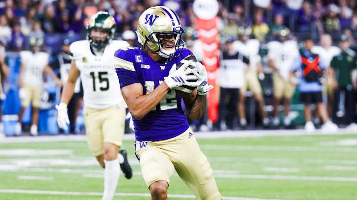  Aug 30, 2025; Seattle, Washington, USA; Washington Huskies wide receiver Denzel Boston (12) catches a pass against the Colorado State Rams during the second quarter at Husky Stadium. Mandatory Credit: Joe Nicholson-Imagn Images | Joe Nicholson-Imagn Images 