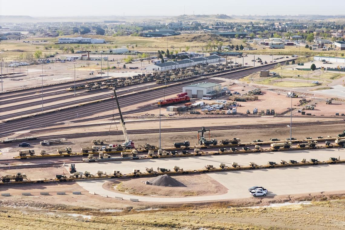Army personnel prepare military equipment for transport by rail, at Fort Carson outside Colorado Springs on April 9, 2026. Public-opinion surveys show that roughly six in 10 Americans oppose the U.S.-led war against Iran; some say they are simply baffled by a conflict that they feel the president did not prepare them for and that still has not been clearly explained. (Michael Ciaglo/The New York Times)