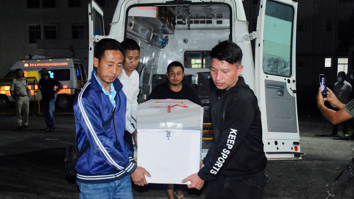 People carry the coffin containing the body of one of six Naga men found dead after they were believed to have been taken hostage by an armed group nearly a month ago, according to state police, at the mortuary in Jawaharlal Nehru Institute of Medical Sciences, Imphal, Manipur, India, June 11, 2026. REUTERS/Stringer