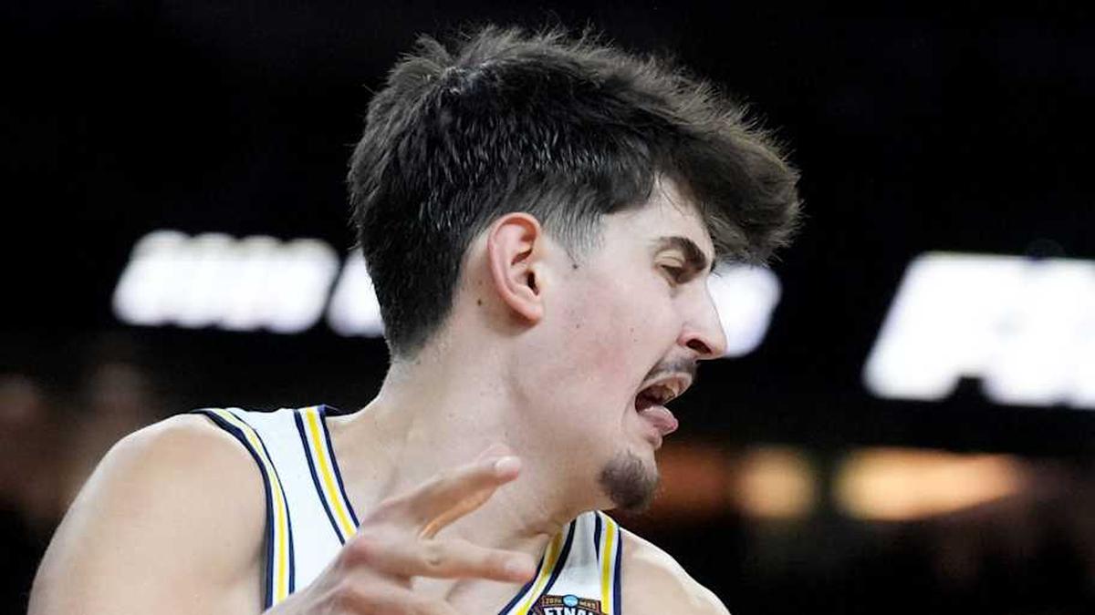 UConn Huskies forward Jayden Ross (23) defends Michigan Wolverines center Aday Mara (15) on Monday, April 6, 2026, during the NCAA men's basketball national championship game at Lucas Oil Stadium in Indianapolis. | Christine Tannous/IndyStar / USA TODAY NETWORK via Imagn Images 