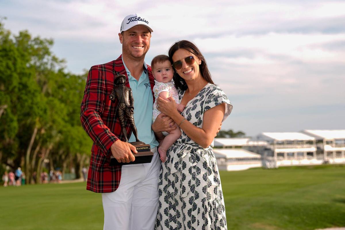 Justin Thomas celebrates his win with his daughter Molly and wife Jilllian during the final round of the RBC Heritage golf tournament. © Jim Dedmon-Imagn Images