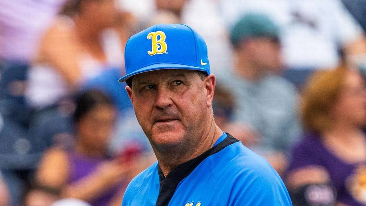  Jun 16, 2025; Omaha, Neb, USA; UCLA Bruins head coach John Savage walks off the field before the game against the LSU Tigers at Charles Schwab Field. Mandatory Credit: Dylan Widger-Imagn Images | Dylan Widger-Imagn Images 