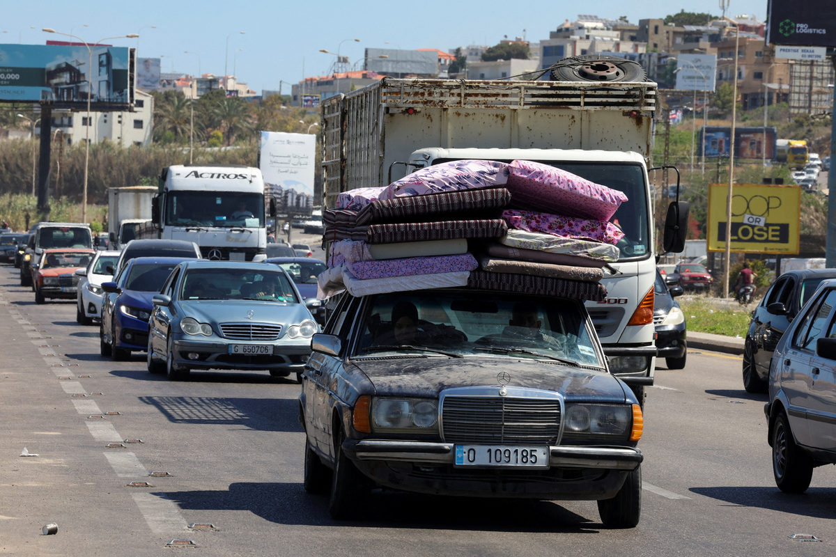Displaced people make their way back to their homes in southern Lebanon following a deal between the U.S. and Iran, in Sidon, Lebanon, June 15, 2026. REUTERS/Aziz Taher