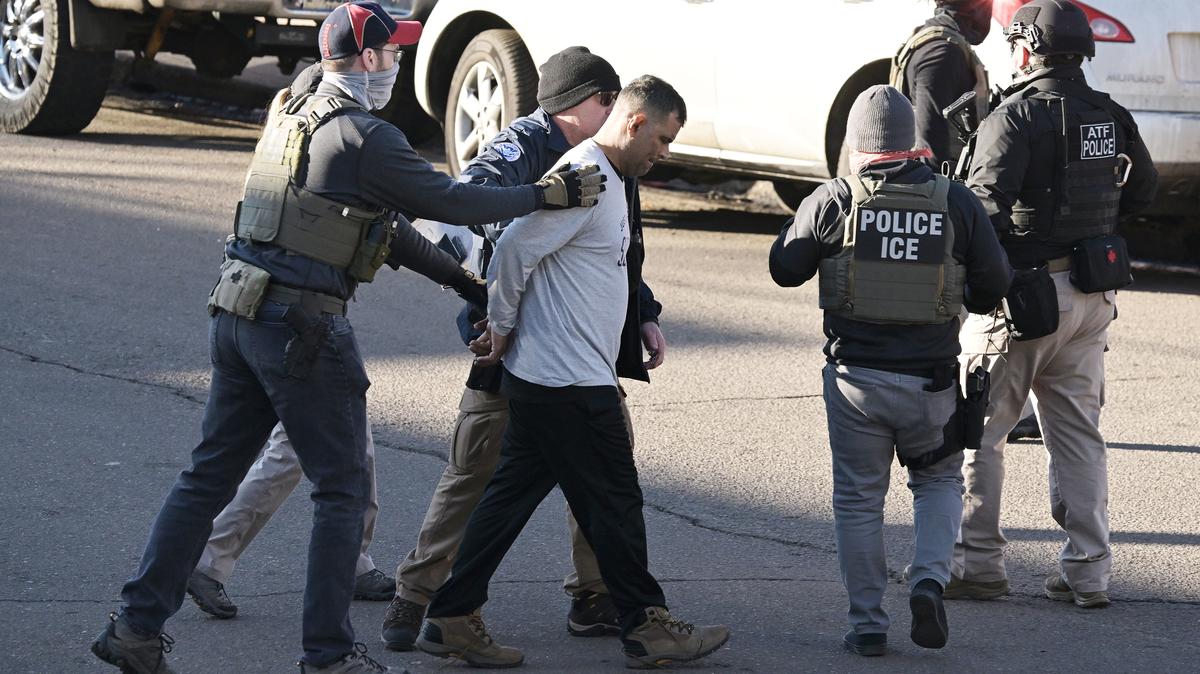 Federal law enforcement officers detain a man during an immigration enforcement operation at the Cedar Run Apartments in Denver on Feb. 5, 2025. (Hyoung Chang/The Denver Post/TNS)