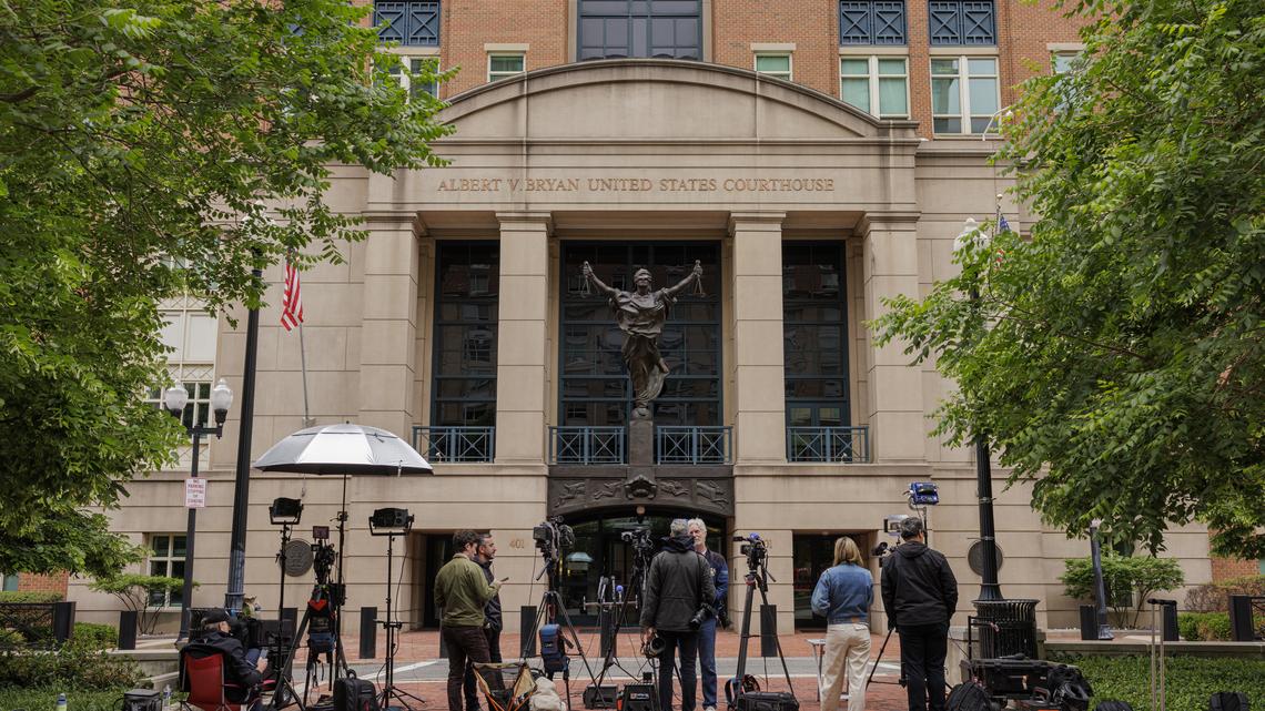 Reporters gather outside of the Albert V. Bryan U.S. Courthouse, where James Comey was to surrender himself, in Alexandria, Va., on Wednesday, April 29, 2026. Comey, the former FBI director, made his first court appearance on Wednesday after being charged over a photograph of seashells he had posted on social media that the Justice Department branded a serious threat to President Trump.