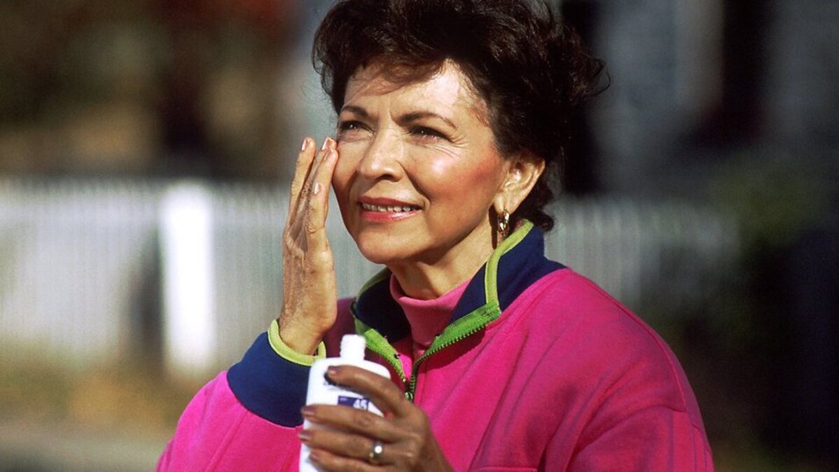A woman applies sunscreen to her face. On Tuesday, the U.S. Food and Drug Administration said it will allow the first new permitted ingredient in over-the-counter sunscreens in 20 years. File Photo by Bill Branson/National Cancer Institute
