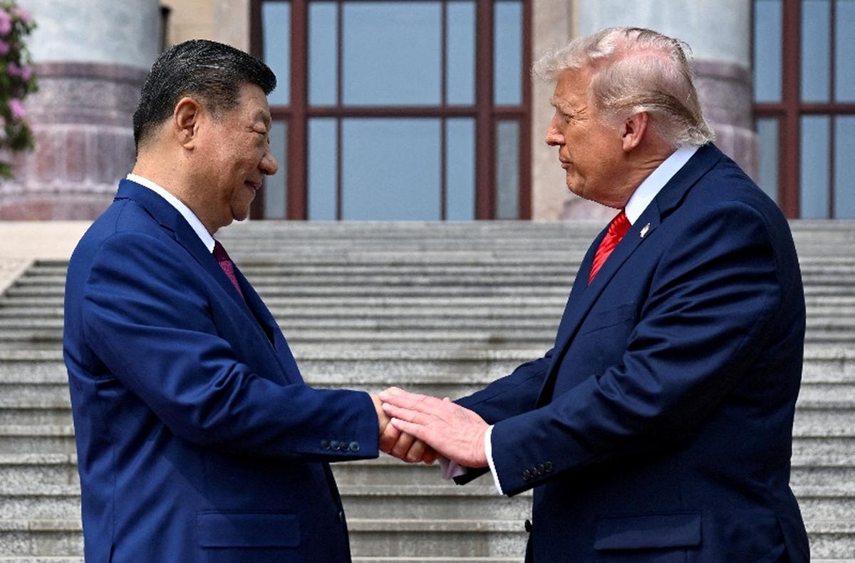FILE PHOTO: U.S. President Donald Trump participates in events at the Great Hall of the People and does a greeting with the President of the People’s Republic of China Xi Jinping May 14, 2026, in Beijing China during a trip focused on trade, regional security, and strengthening bilateral ties between the world’s two largest economies. Kenny Holston/Pool via REUTERS/File Photo