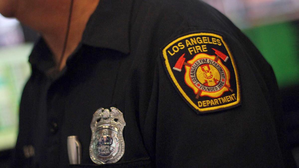 A man was found dead Saturday, May 9, 2026,  following a fire that broke out at a South Los Angeles home and sent flames and fireworks into the sky.(Bob Chamberlin/Los Angeles Times/TNS)