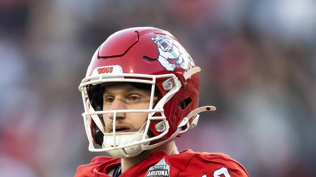  Dec 27, 2025; Tucson, AZ, USA; Fresno State Bulldogs quarterback E.J. Warner (13) against the Miami (OH) RedHawks during the Snoop Dogg Arizona Bowl at Casino Del Sol Stadium. Mandatory Credit: Mark J. Rebilas-Imagn Images | Mark J. Rebilas-Imagn Images 