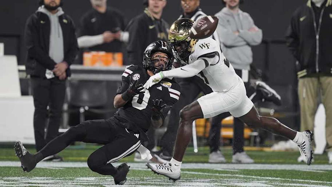  Jan 2, 2026; Charlotte, NC, USA; Mississippi State Bulldogs wide receiver Brenen Thompson (0) makes a opening play catch defended by Wake Forest Demon Deacons defensive back Karon Prunty (3) during the first quarter at Bank of America Stadium. Mandatory Credit: Jim Dedmon-Imagn Images | Jim Dedmon-Imagn Images 