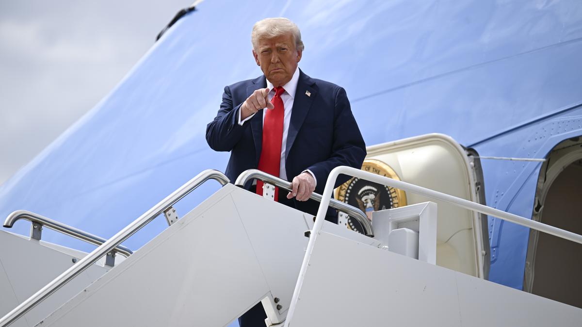 President Donald Trump arrives at Luke Air Force Base in Glendale, Ariz., en route to the memorial service for Charlie Kirk at State Farm Stadium in Glendale, Ariz., on Sunday, Sept. 21, 2025.