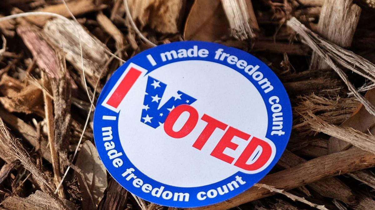An "I Voted" sticker sits on a wood chip pile outside of the polling center on Presidential Primary Election day for Democrat candidate Joe Biden or Sen. Bernie Sanders at the Lake Worth community center in Lake Worth, Florida on Tuesday, March 17, 2020. Lines at the polling sites are non existence due to the Coronavirus Pandemic. Photo by Gary I Rothstein/UPI