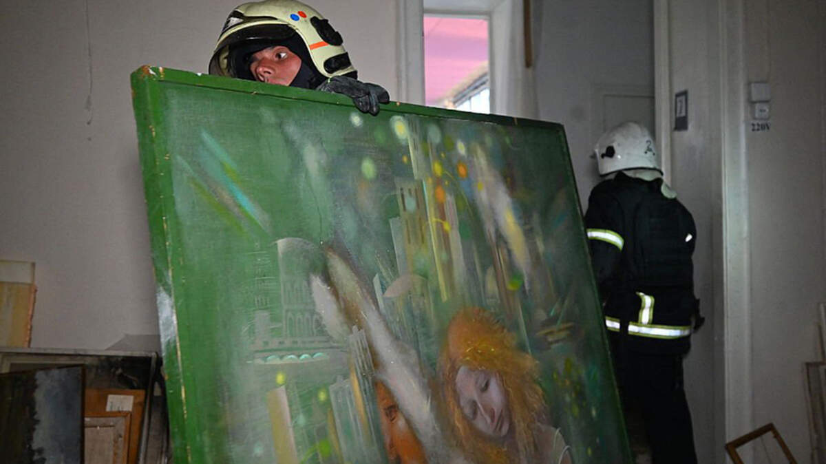 Firefighters move paintings to the basement of the damaged Kharkiv Art Museum following a drone strike in Kharkiv, Ukraine, on Sunday. As Moscow and Kyiv continued to trade missile and drone attacks, President Donald Trump told Russian President Vladimir Putin on Sunday that ending the conflict in Ukraine was vital and he was ready to help.